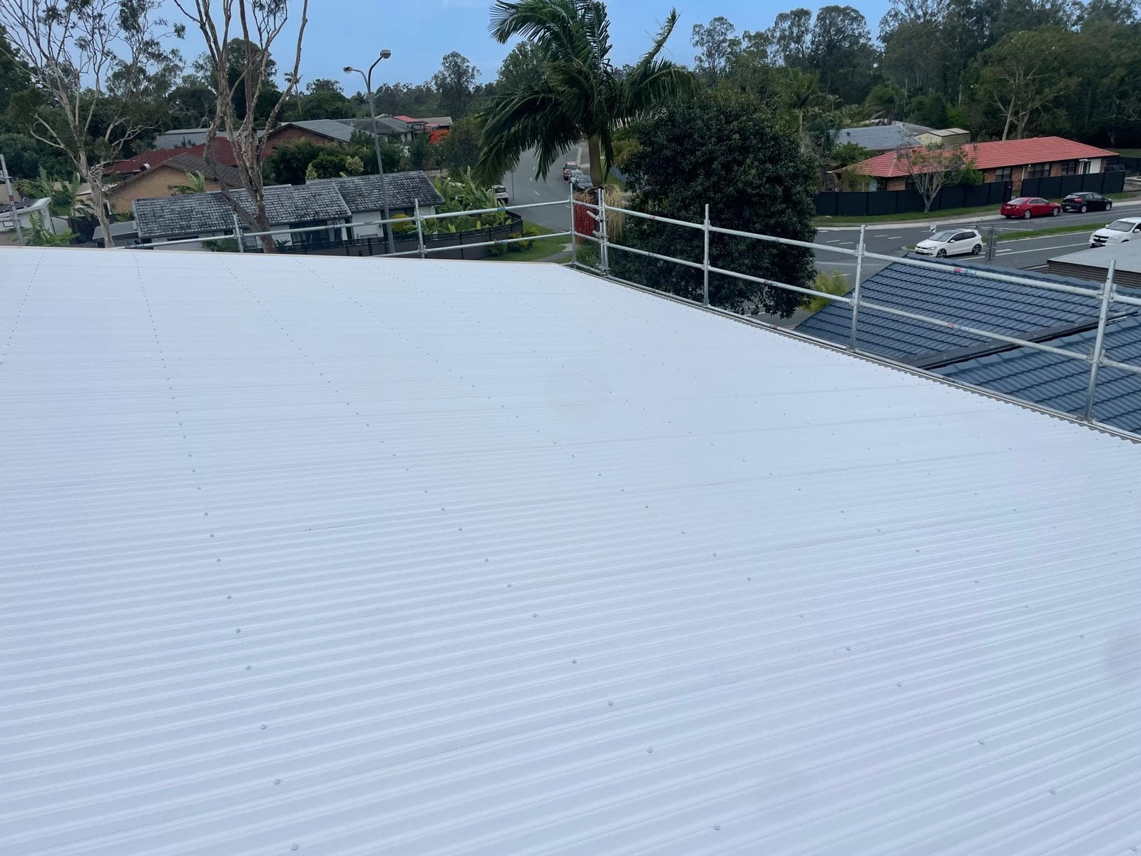 Finished new metal roof installation in Helensvale Gold Coast demonstrating quality roofing workmanship by local Gold Coast roofers