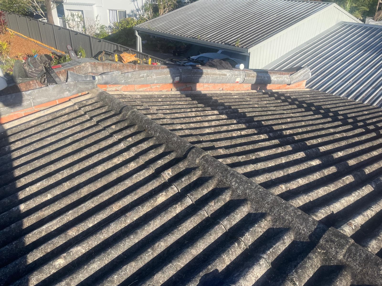 Asbestos roof before replacement in Mudgeeraba Gold Coast - safe asbestos removal by licensed CBMR roofing contractors