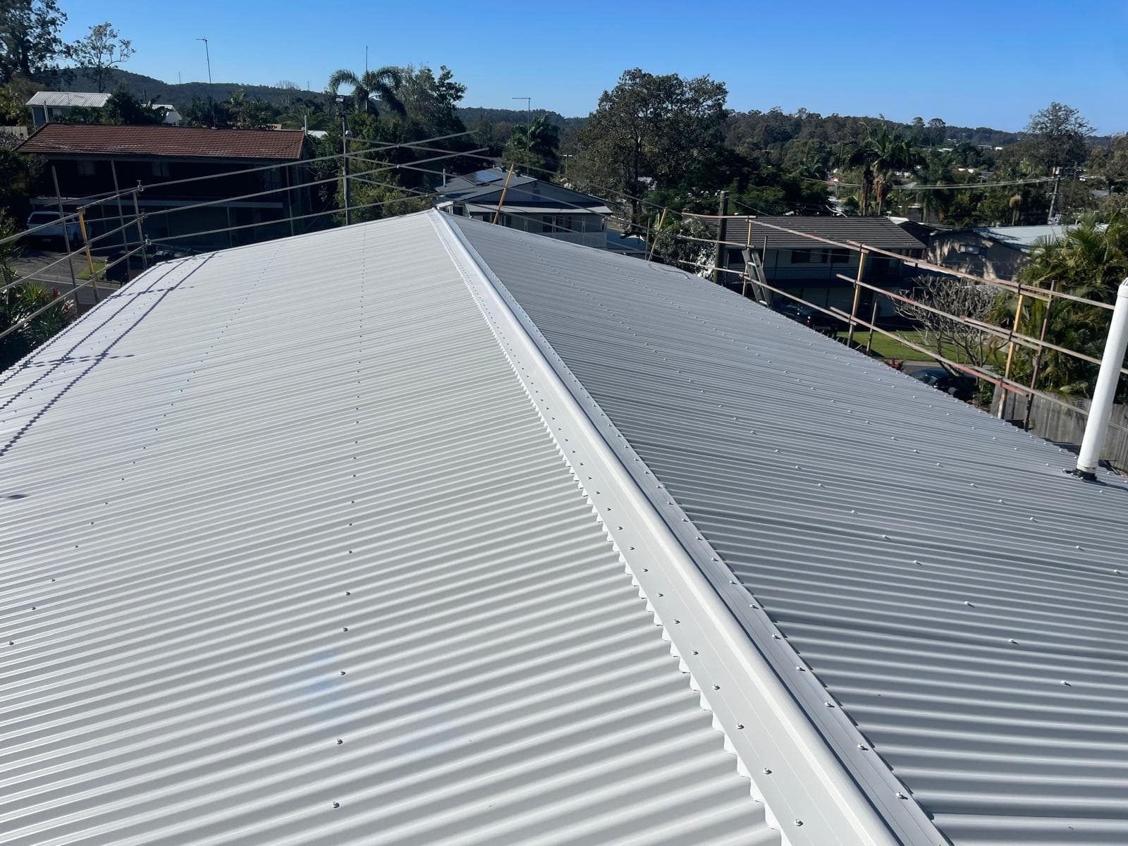 Aerial view of completed asbestos roof replacement in Nerang Gold Coast featuring premium Colorbond metal roofing installation