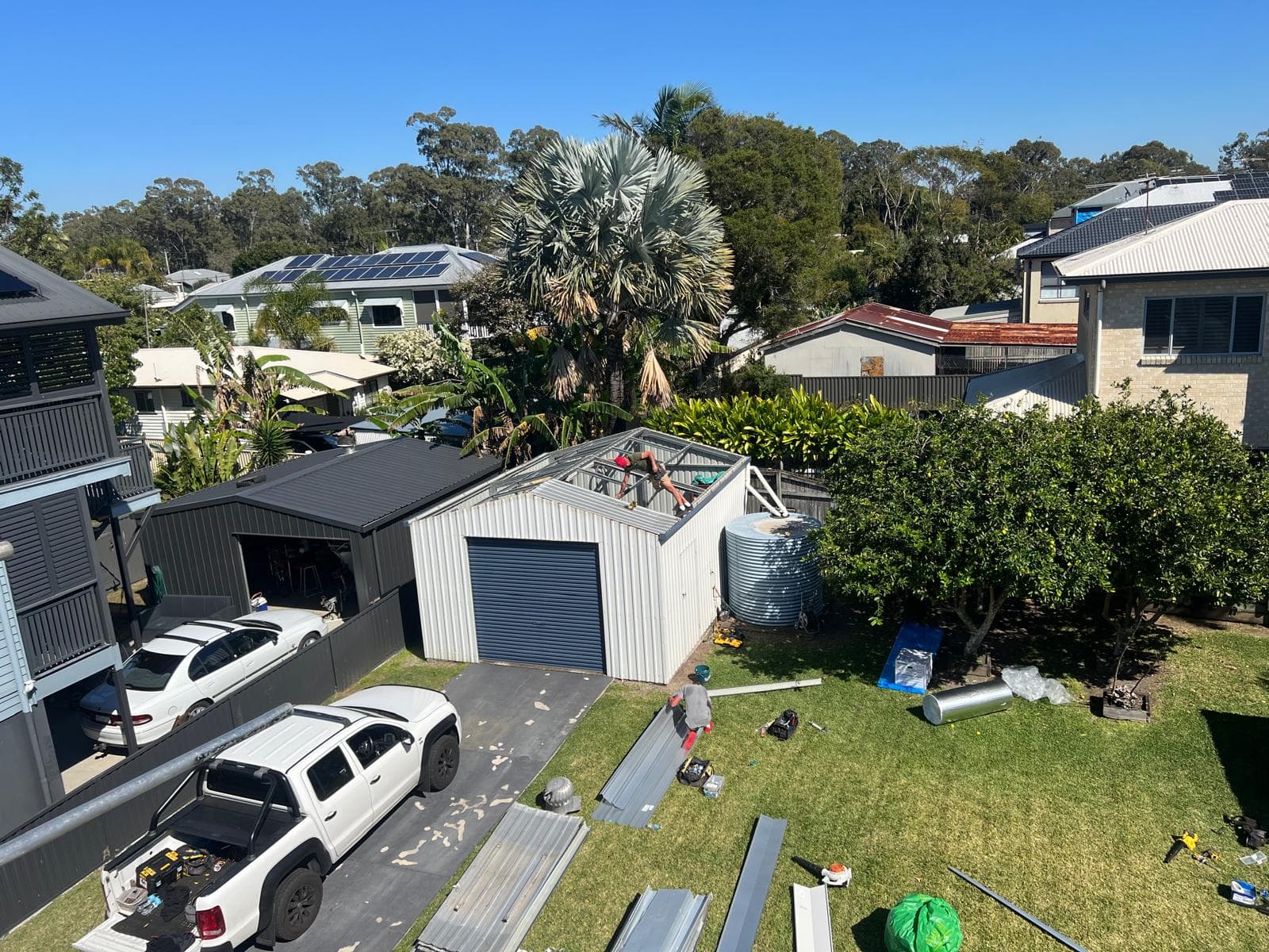 CBMR crew fitting new battens on a rear shed during a metal roof replacement in Lota, Brisbane bayside