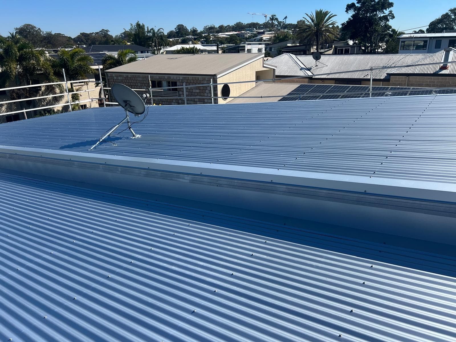 Completed blue-grey Colorbond metal roof on a home in Lota, Brisbane bayside