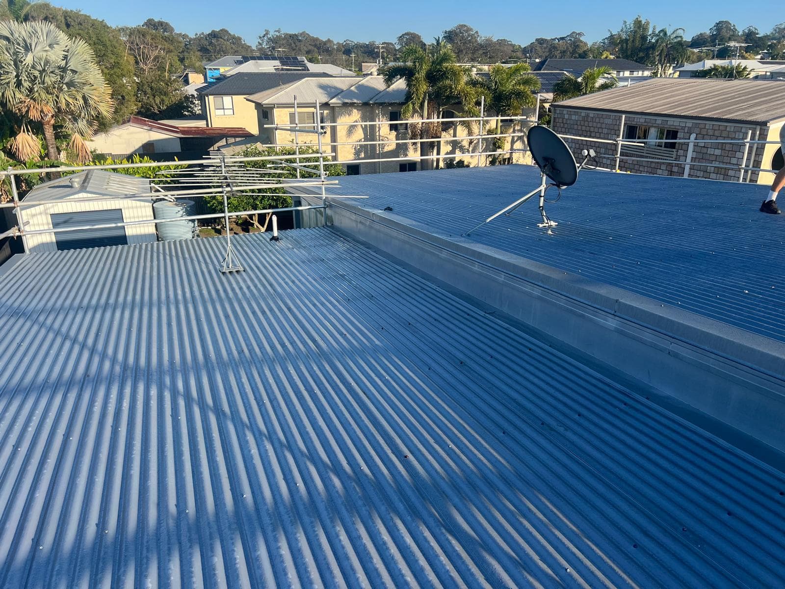 Wide view of a completed corrugated Colorbond roof replacement in Lota, Brisbane