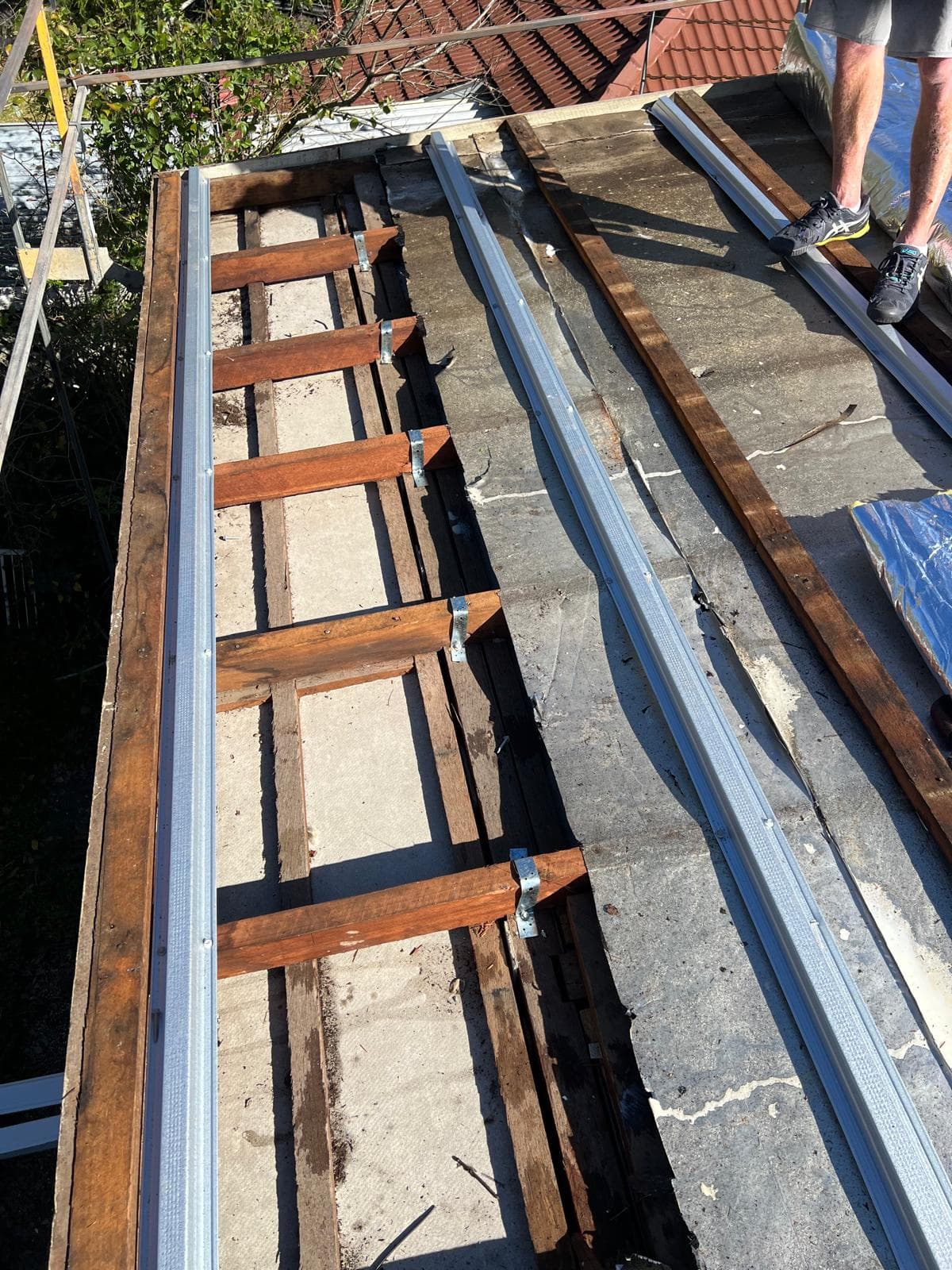 Old roof battens being replaced on a home in The Gap, Brisbane after asbestos sheet removal