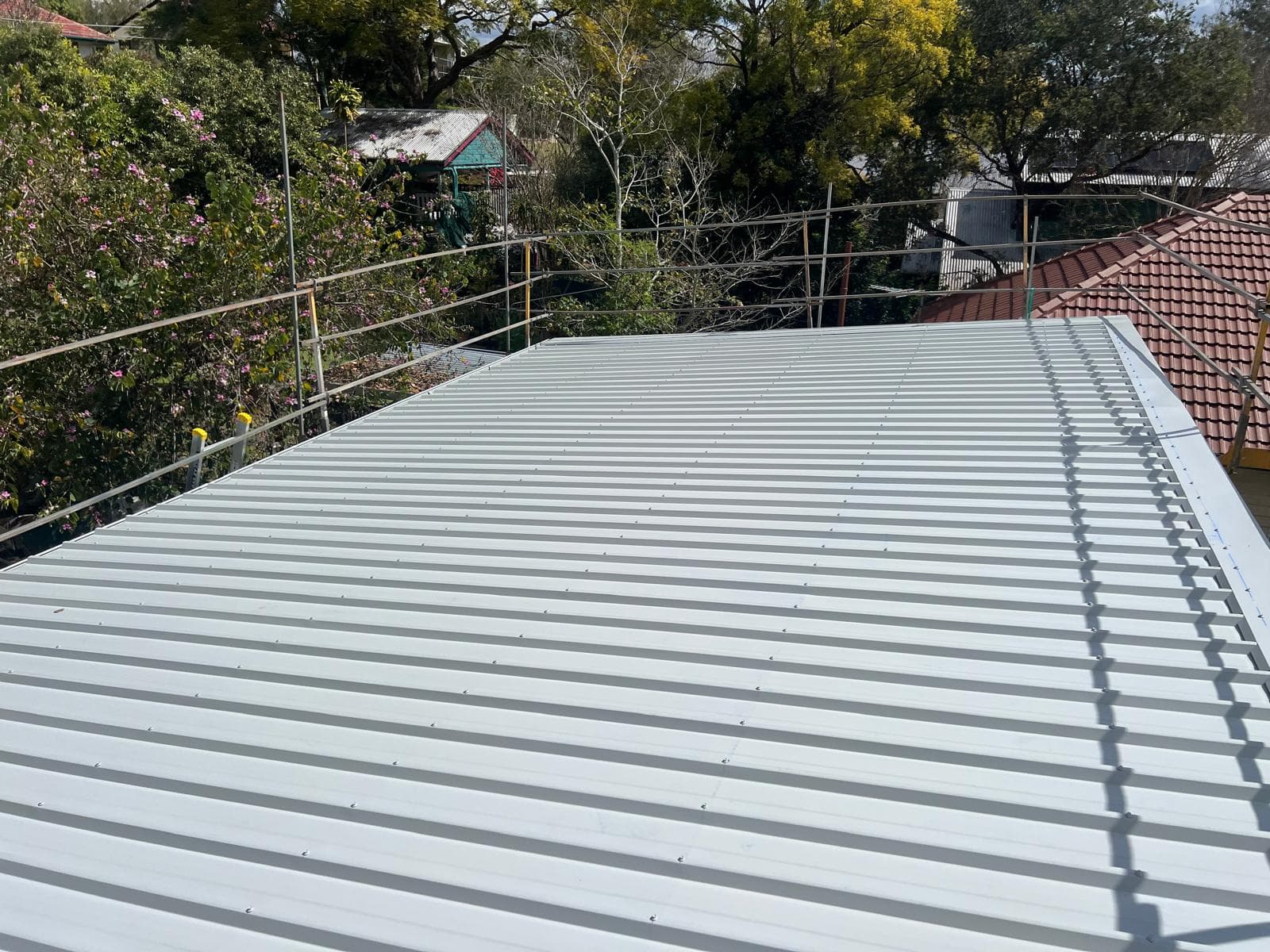 Finished light-coloured Colorbond roof after asbestos removal in The Gap, Brisbane