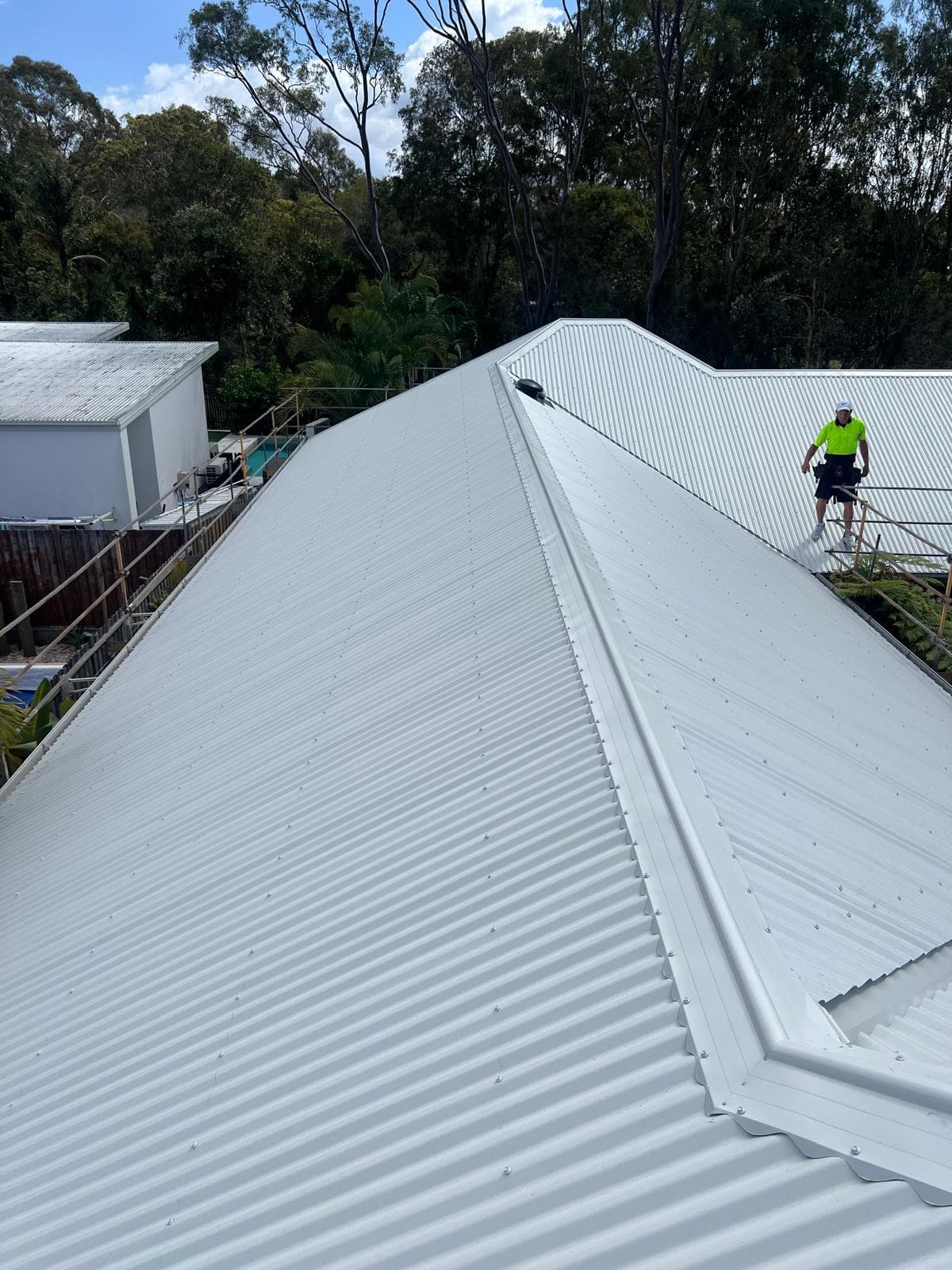 Finished ridge capping on a new Colorbond metal roof in Wakerley, Brisbane